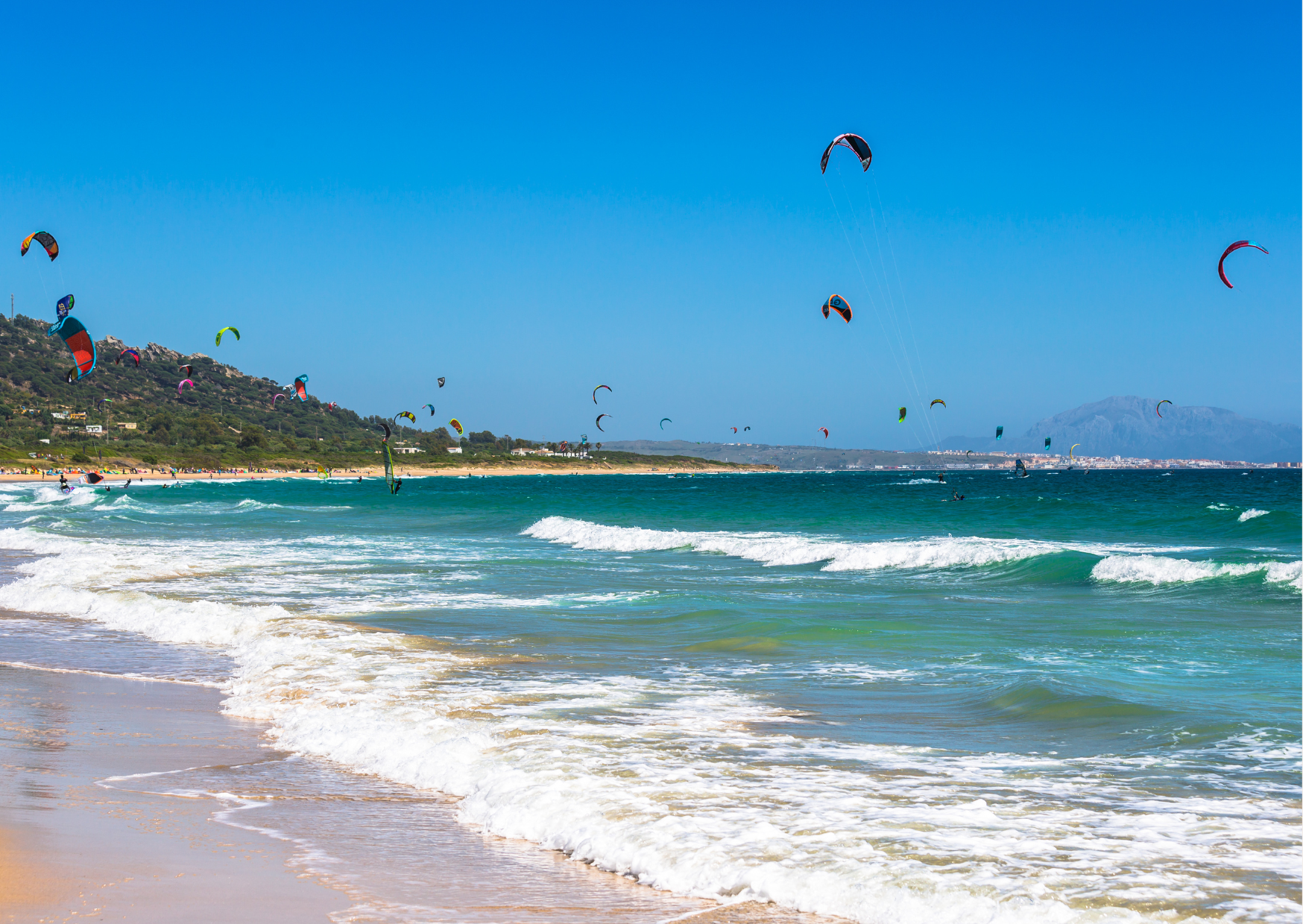 Tarifa, located at the southern tip of Spain, is known as the 'Windsurfing Capital of Europe.' With strong, consistent winds throughout the year, Tarifa is a paradise for kitesurfers. The best time to go is between April and October, with peak winds during the summer months.